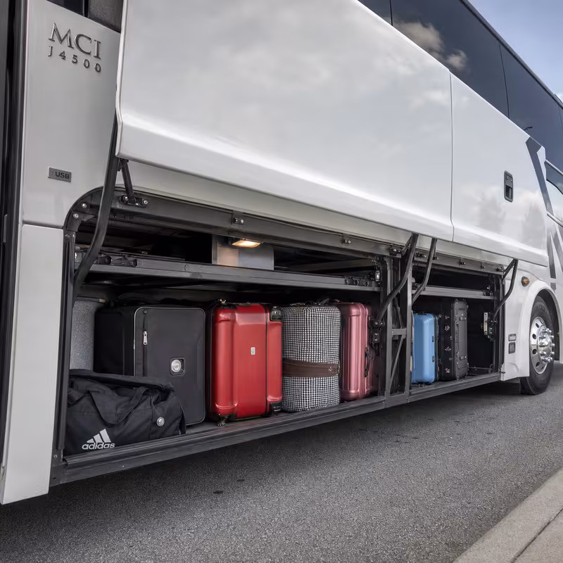 Party bus interior with wraparound leather seating and LED lighting in Hayward