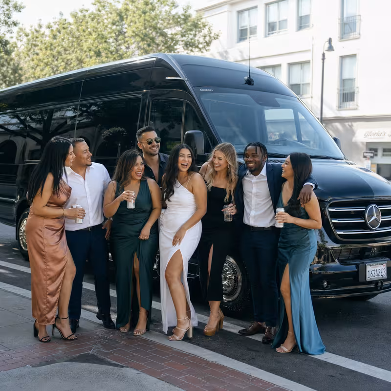 Group boarding a white charter bus for Bachelor & Bachelorette Transportation transportation in Hayward