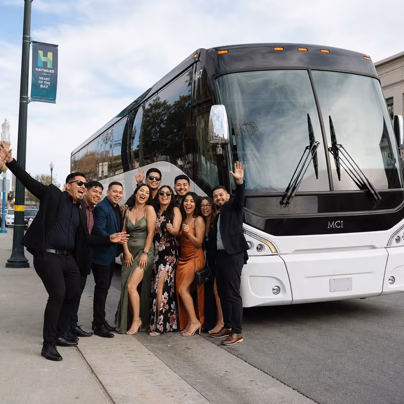 Passengers loading luggage while boarding an Hayward group shuttle