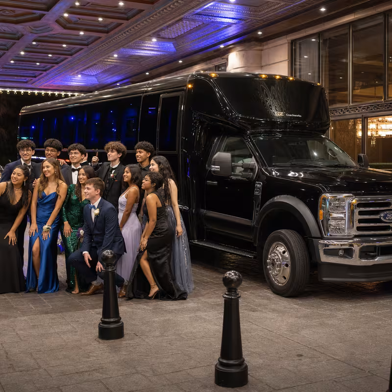 Party bus interior with wraparound leather seating and LED lighting in Hayward