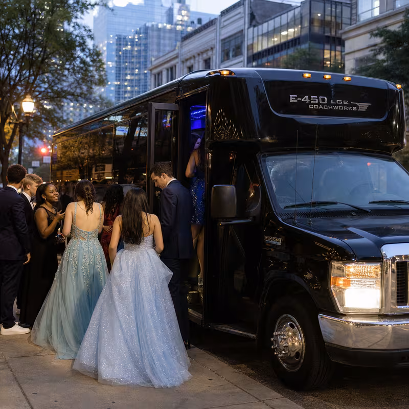 Passengers loading luggage while boarding an Hayward group shuttle