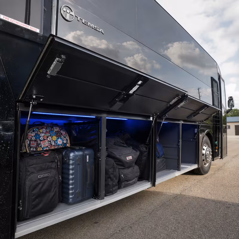 Party bus interior with wraparound leather seating and LED lighting in Hayward