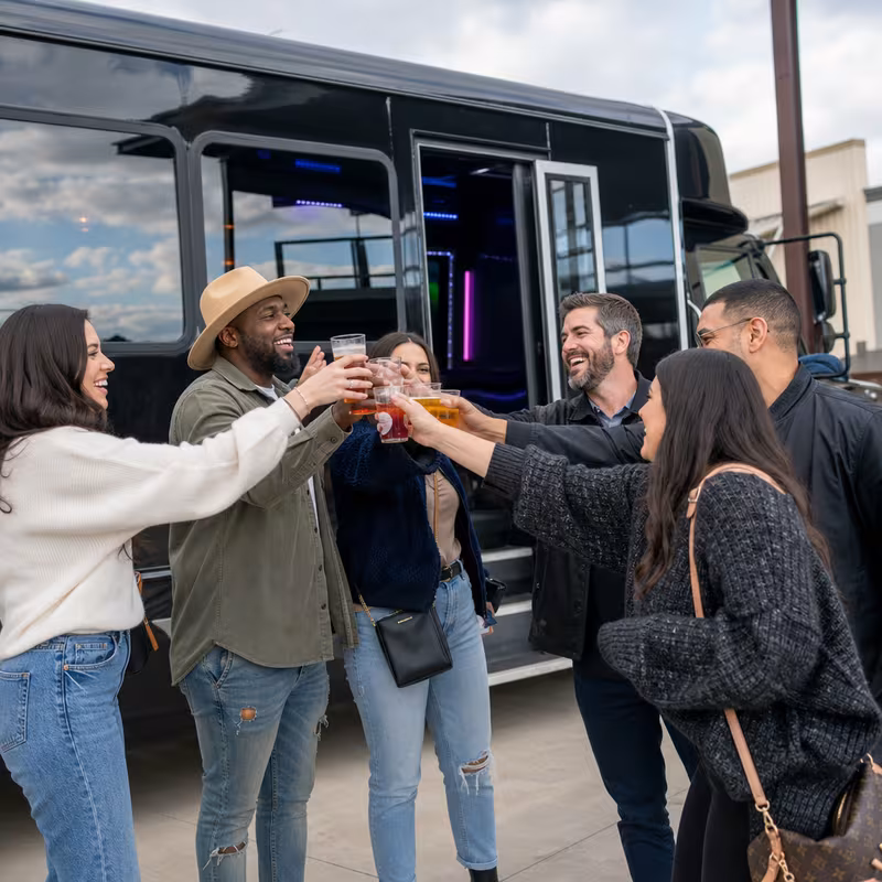 Passengers loading luggage while boarding an Hayward group shuttle